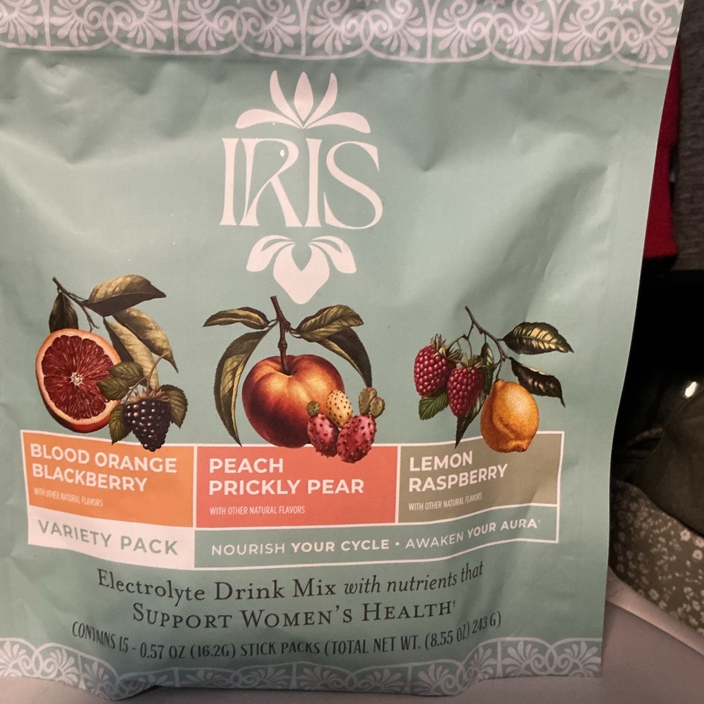 iris electrolyte drink mixes in mint green, orange, and peach packaging